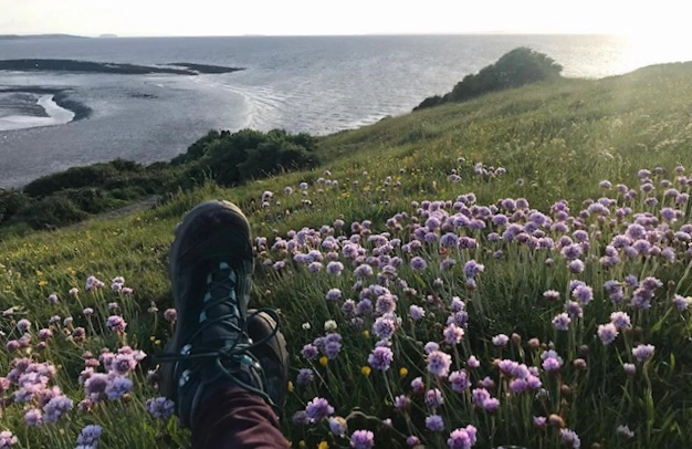 Helen Wood Image of some hiking boots near the sea